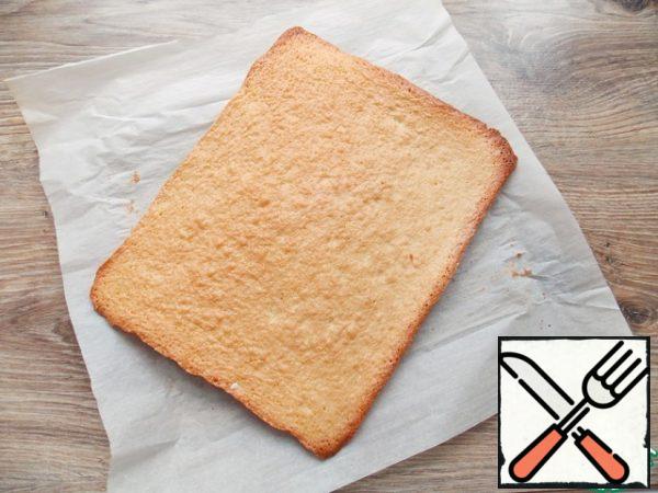 Cover the baking sheet with baking paper and pour out the dough, smooth it out. Bake in a hot oven at t = 180 degrees for 15 minutes, until cooked. Remove, cool and remove the paper.