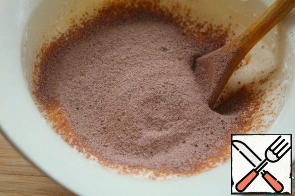 Add the sifted cocoa mixture to the whites in parts, each time mixing well and carefully from the bottom up with a spatula or wooden spoon - DO not just MIX!
The last portion I mixed with a mixer at low speed