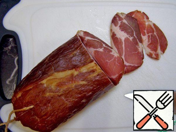 Cut the bacon into thin slices.