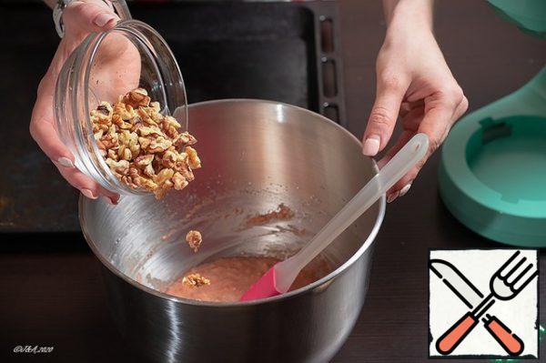 Add carrots and nuts. Before that, fry the nuts.