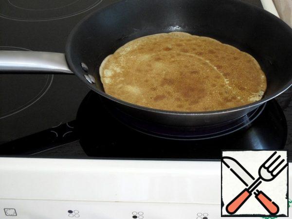 When one side is browned, flip and brown the back of the pancake.