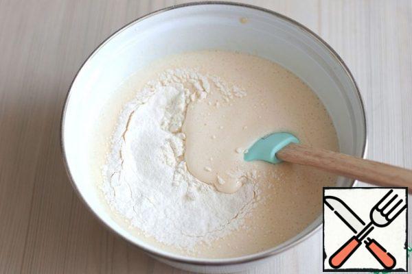 In a separate bowl, combine the flour (180 gr.), starch (60 gr.), baking powder (1 pack.). pre-sift the Flour.
Gradually add the dry ingredients in batches to the bowl with the whipped whites. Gently mix the mass from the bottom up.