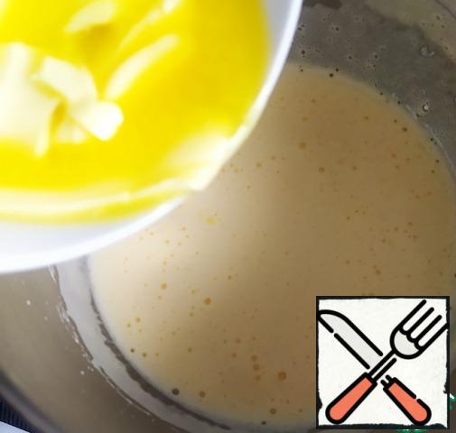Then add the softened butter and continue to beat.