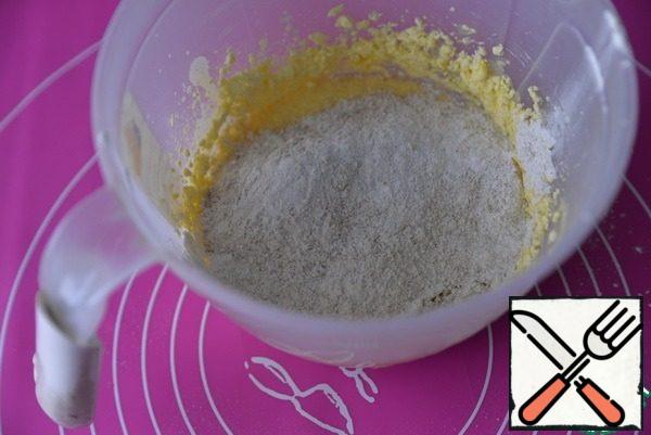 Mix the egg-oil and flour mixture. Mix well. Flour may need a little more, but do not clog the dough, it should become soft and not stick to your hands.