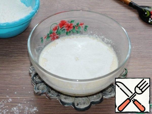 Mix flour into the liquid mixture in small portions.