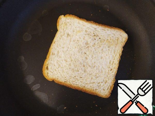 Making toast.
If the crust of the bread is hard, cut it off.