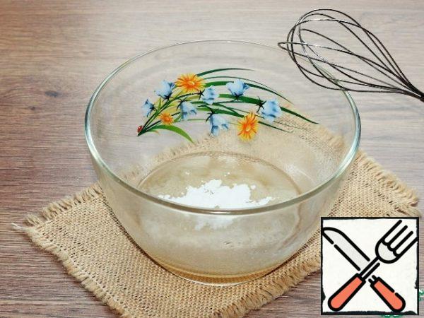 Add the flour mixture to the oil mixture in small portions.
