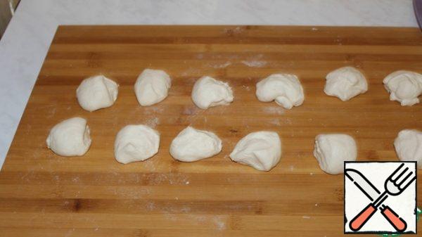 Divide the dough into 12 equal parts.