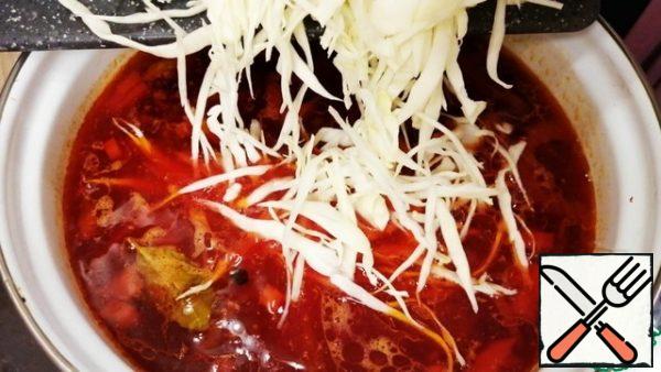 After 5 minutes, add the chopped cabbage and cook until it is ready, about 5-7 minutes.
