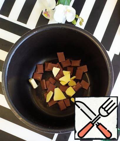 Put the chocolate and butter in the bowl of slow-cooker. Close the cover. Set the program "MILK PORRIDGE" cooking time 10 minutes. When ready, mix the melted chocolate with the butter until smooth and transfer to a pastry bag.
