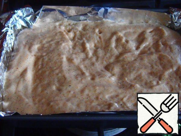 Take out the mold with apples and pour the dough on the apples, level the surface. Reduce the temperature in the oven to 180 degrees and bake the pie for about 15 minutes, check the readiness with a match.