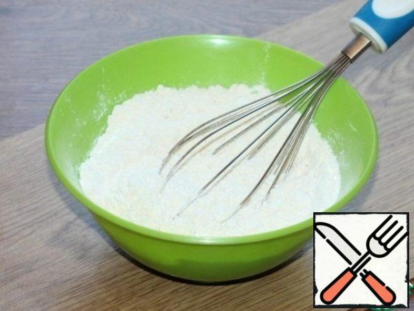 Mix with a whisk: flour, starch and baking powder, sift.