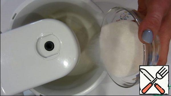 Whisk the whites and gradually add sugar.