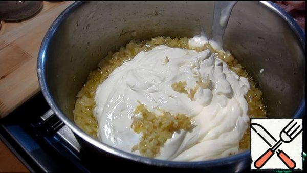 Add sour cream and garlic.