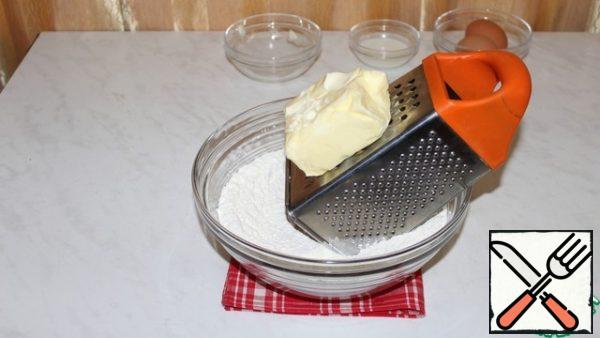 Grate the butter on a grater.