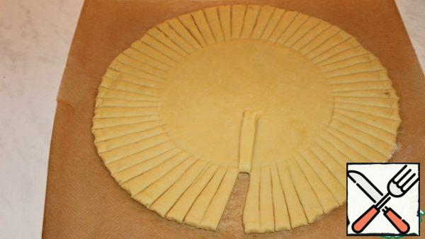 In a circle we make incisions with a width of 8 mm. Bend one strip.
