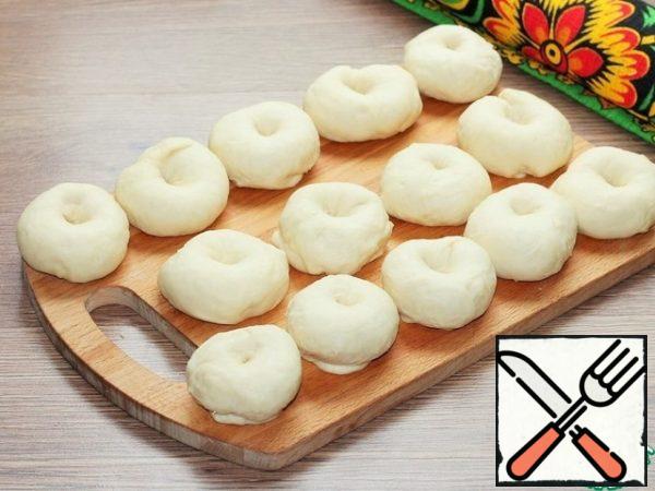 Divide the dough into 14 parts and roll into balls. Cover with a film or transparent bag, so that the dough does not chafe.