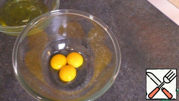 Take two containers and separate the whites from the yolks.