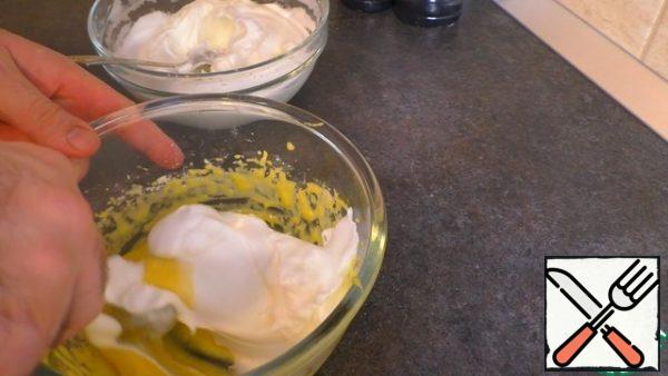 In the yolk mass, add the whites in small portions and gently mix.