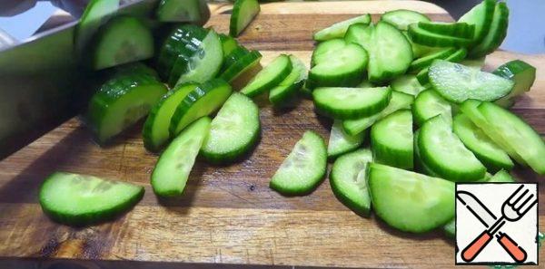 Cucumber cut into half rings, radish - circles, green onion and dill - finely.