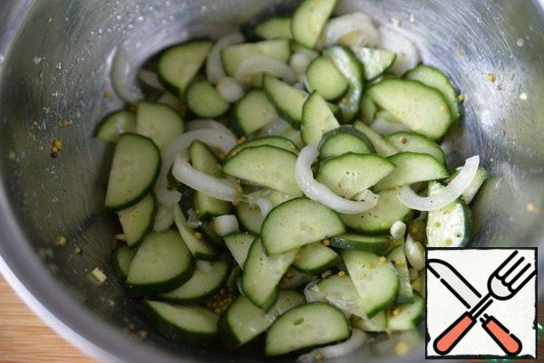Pour the marinade over the cucumbers and onions, mix and refrigerate for 1 hour.
