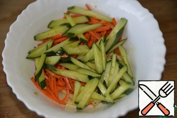 Add the sliced cucumbers.