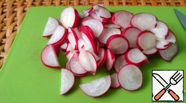 Radish cut into thin rings or semi-rings, depending on the size.