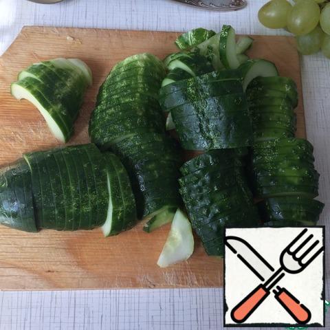 Cut the cucumbers into large chunks.