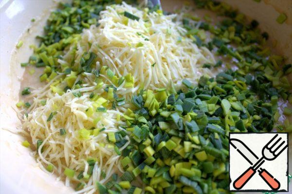 Pour in the dough and grated cheese, too.