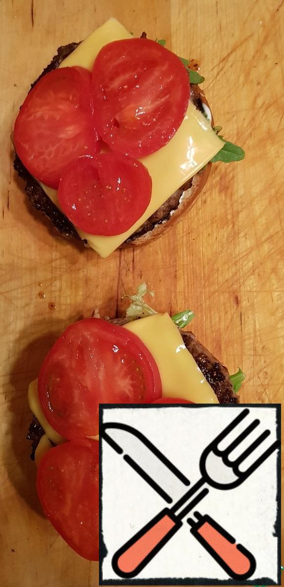 Cut into slices of tomato and put on the cheese.