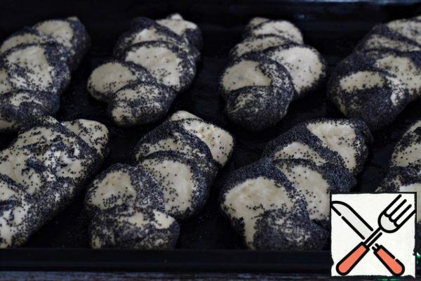 Put the rolls on a baking sheet lined with Teflon sheet or parchment. Cover the rolls with a thin towel and leave for 10-15 minutes, let them "rest".