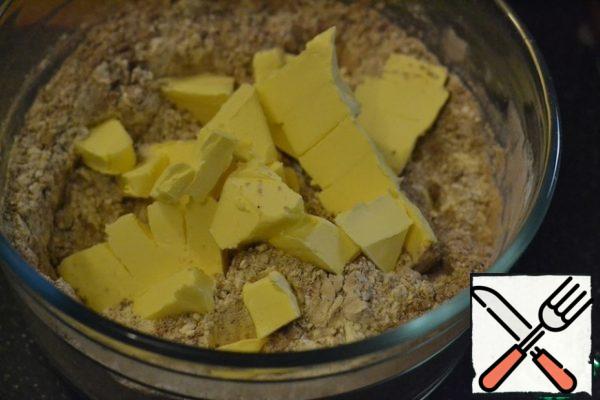 Add the butter, cut into pieces, and the egg.