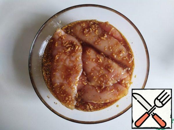Soak the chicken Breasts, cover with cling film and leave in the refrigerator for an hour and a half.
