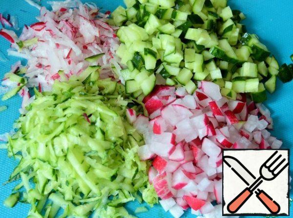 Grate 1/3 of the cucumbers and radishes, and cut the rest into small cubes. Combine with greens.