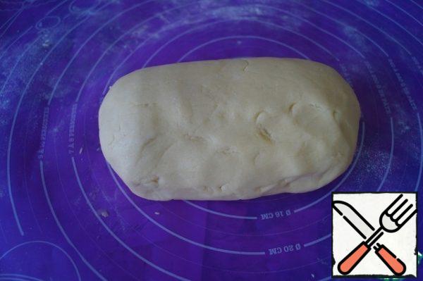 Mix the egg mass with flour crumbs and knead a soft and elastic dough. Put it in the refrigerator for 15 minutes.