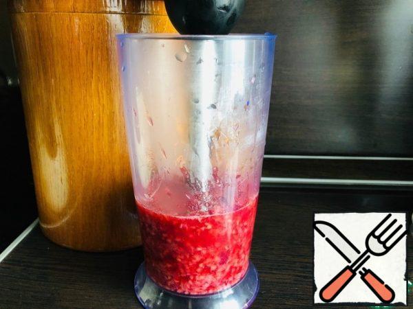 Transfer the raspberries to a blender and turn into a puree.