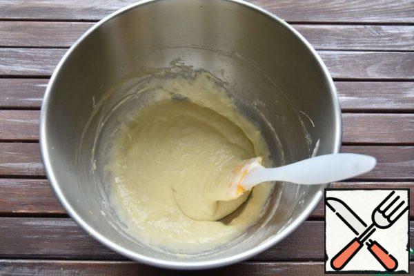 Pour in the melted and cooled butter. Mix it into the dough.