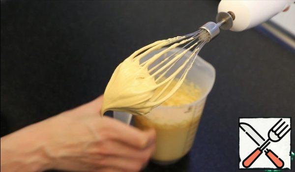 Whisk with a blender for 3-4 minutes until a lush, airy state.
