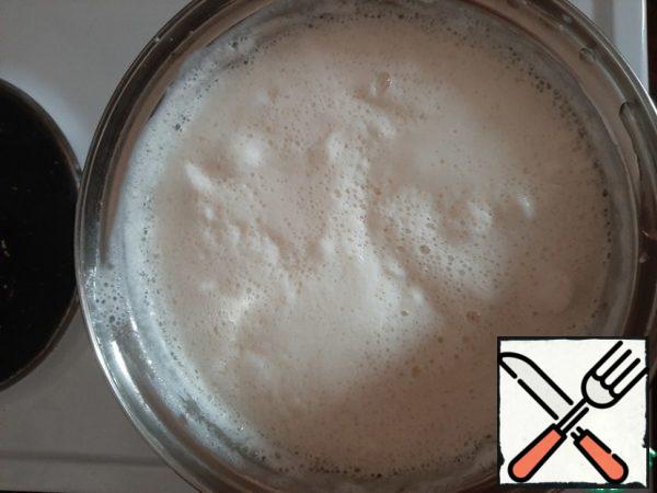 Add the broken marshmallows to the boiling milk and stir constantly until the marshmallows are completely dissolved.