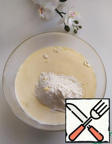Then add the sifted flour (250 gr.) with vanilla and baking powder. Mix with a spatula.