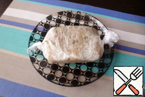 Roll it up carefully. Put it in a convenient container and put a small load on top.
Allow to cool and freeze in the refrigerator.
