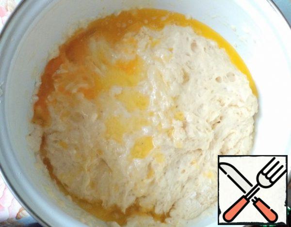 Add milk with yeast, egg and melted butter to the flour.