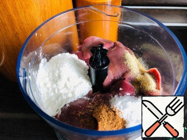 Wash out the liver and remove all the excess. Transfer the liver to a blender bowl, add salt, ground black pepper, dried garlic, corn starch, and combine into a homogeneous mass