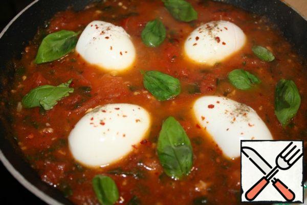 Cut the eggs in half and put them in the sauce.
I added more Basil leaves.