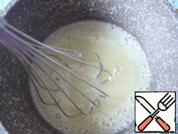 Remove from the heat and, whisking vigorously, add the cream, vanilla syrup and a pinch of salt. Set aside to cool to room temperature.