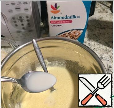Add almond milk and vanilla extract.