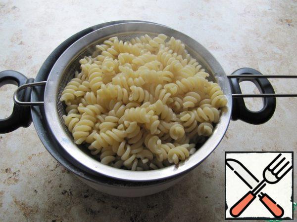 Cook the pasta to your taste in slightly salted water until almost ready, then drain.