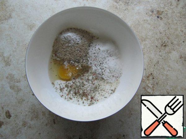 Bran, rice (wheat) flour, kefir, baking powder, chicken egg, a mixture of Italian herbs, salt to taste, combine in a bowl.