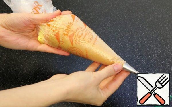 I put it in a pastry bag with this attachment for filling cakes!