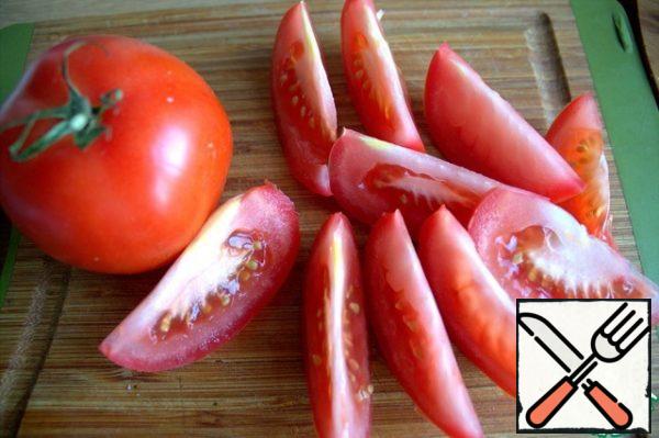 Slice a fresh tomato.